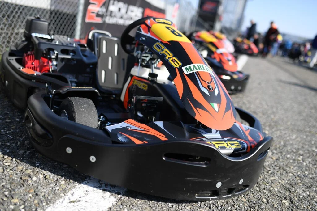 Black and Orange Italian made high-speed rental kart with yellow accents. CRG branding.